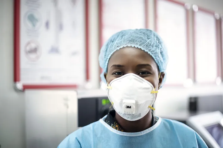 A lab technician wearing a facemask
