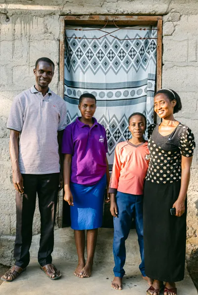Vivian Nandi and her family outside their home in Nyalikungu, Tanzania (c) Amref Health Africa/Sam Vox